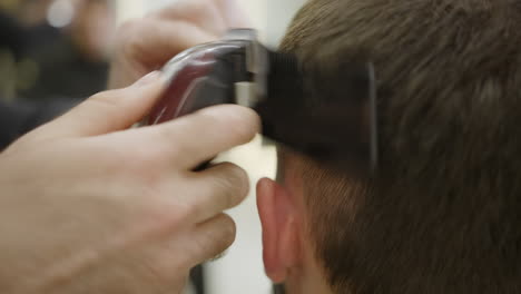 man getting a haircut at the barbershop