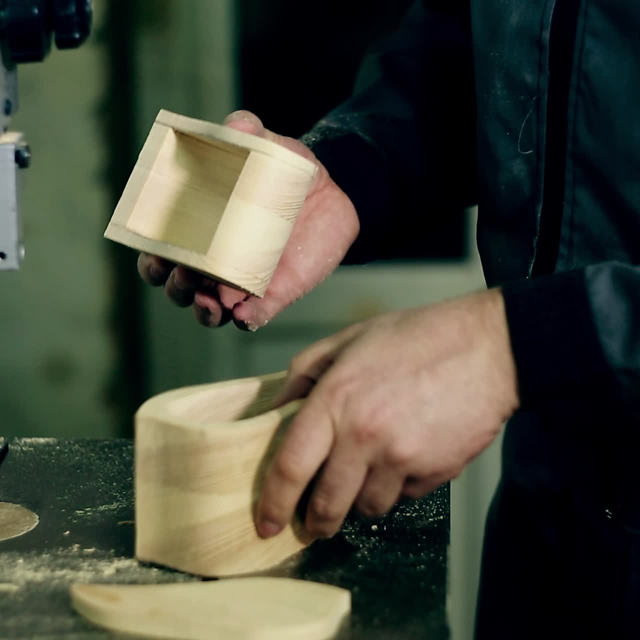 Man Uses An Electric Saw To Cut Wooden Planks
