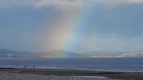 Scenic-rainbow-beautiful-colours-over-Welsh-mountains-coastal-seascape-horizon