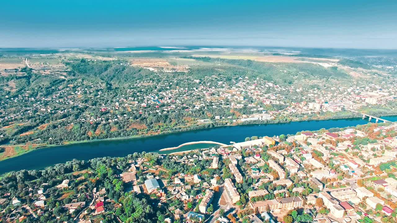 Village on the shore. Aerial view of village near pond in countryside
