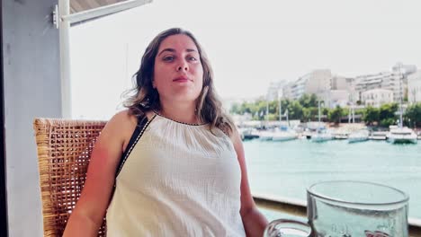 athens harbor selfie: tourist girl vlogging by yachts