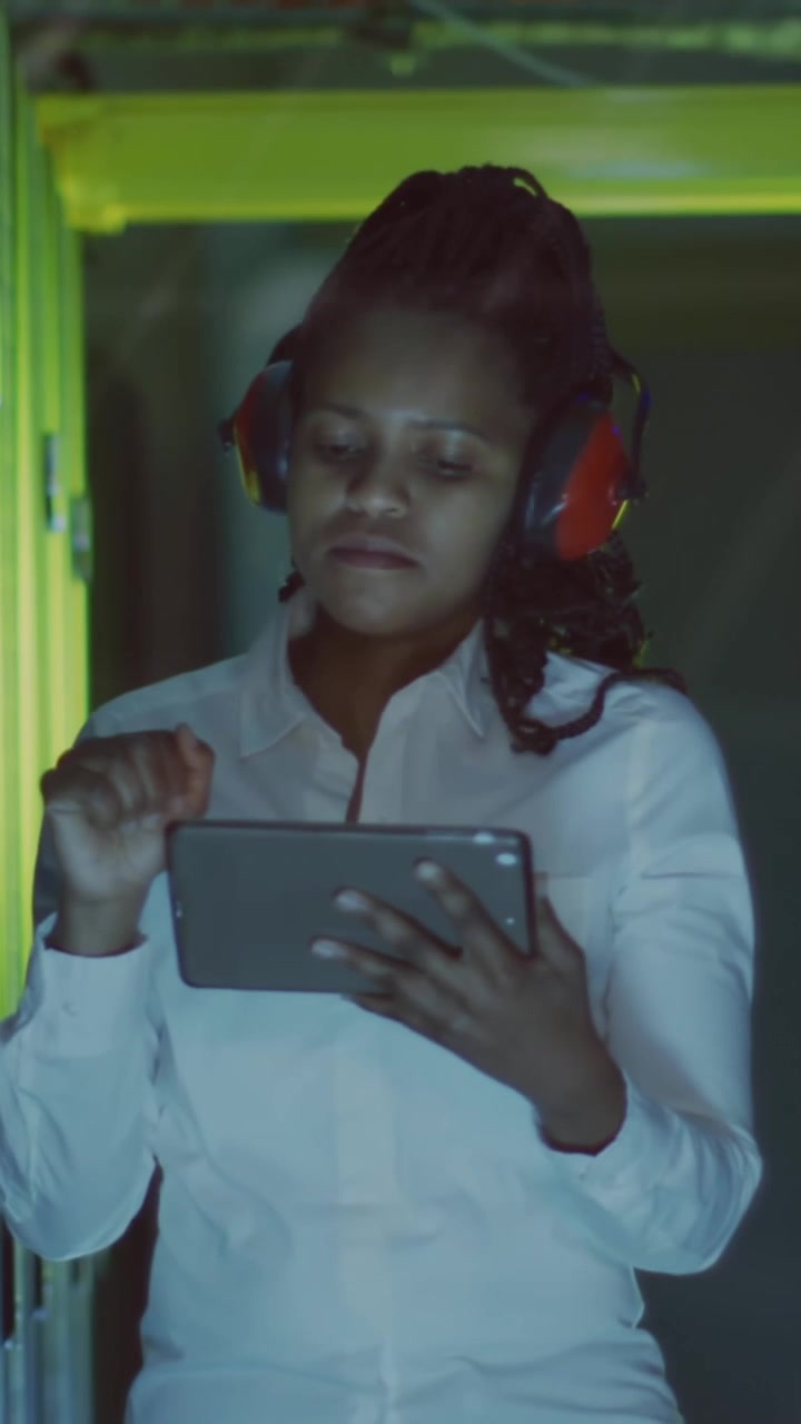 Animation of data processing over african american female it engineer by computer servers