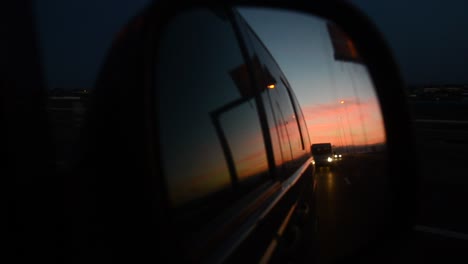 side mirror of a car on a sunset trip