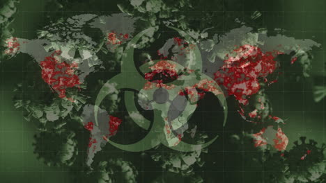 biohazard symbol and multiple covid-19 cells floating against world map on green background