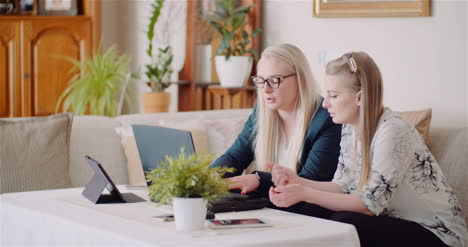 Female-Colleagues-Discussing-Business-Strategy-In-Office-9