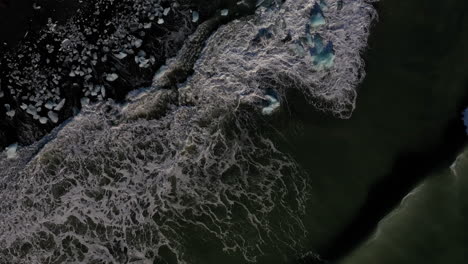 Overhead-View-Of-The-Beautiful-Diamond-Beach-In-South-Iceland-With-Icy-Waves-Rolling-To-The-Shore---Aerial-Shot