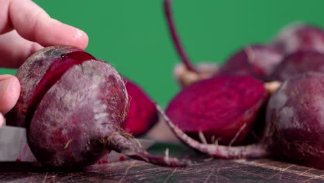 sliced fresh beets on a cutting board.