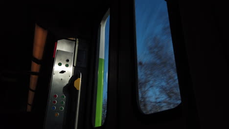 Passenger-point-of-view-looking-out-of-a-fast-moving-train-at-the-trees-going-by