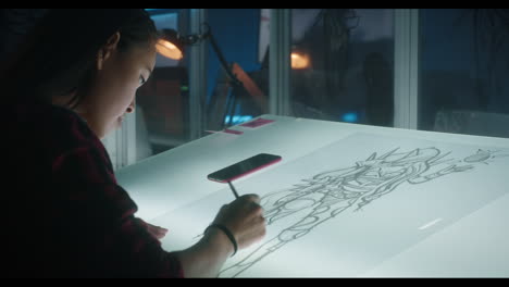 Young artist working on character design