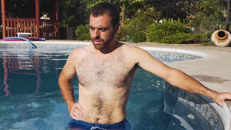 swimmer breathing deeply in a beautiful swimming pool