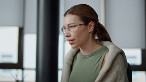 Startup-employee-working-computer-closeup.-Focused-woman-searching-data-online