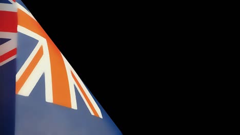 cámara lenta de la bandera nacional australiana contra un fondo negro