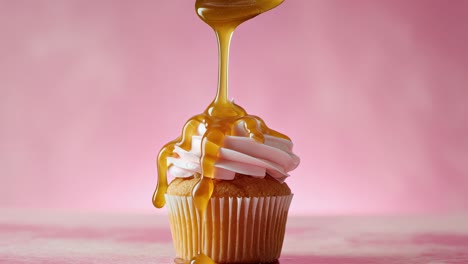 indulge in a delicious cupcake adorned with a sweet caramel drizzle for pure delight