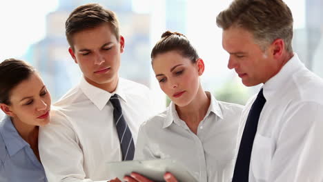 team of business people working on tablet