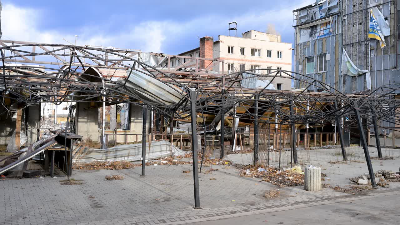 In Kramatorsk, Ukraine, a destroyed commerce building is a stark reminder of war. Rubble and debris highlight the devastating impact of the ongoing Ukraine-Russia war and brutal urban warfare.