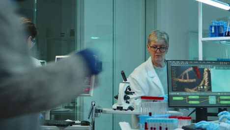 chemist nurse typing on computer standing in lab