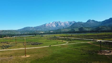 Green-Fields-And-Mountains-Near-Lake-Hemet-In-California---Aerial-Drone-Shot