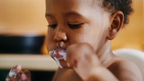 baby eating yogurt