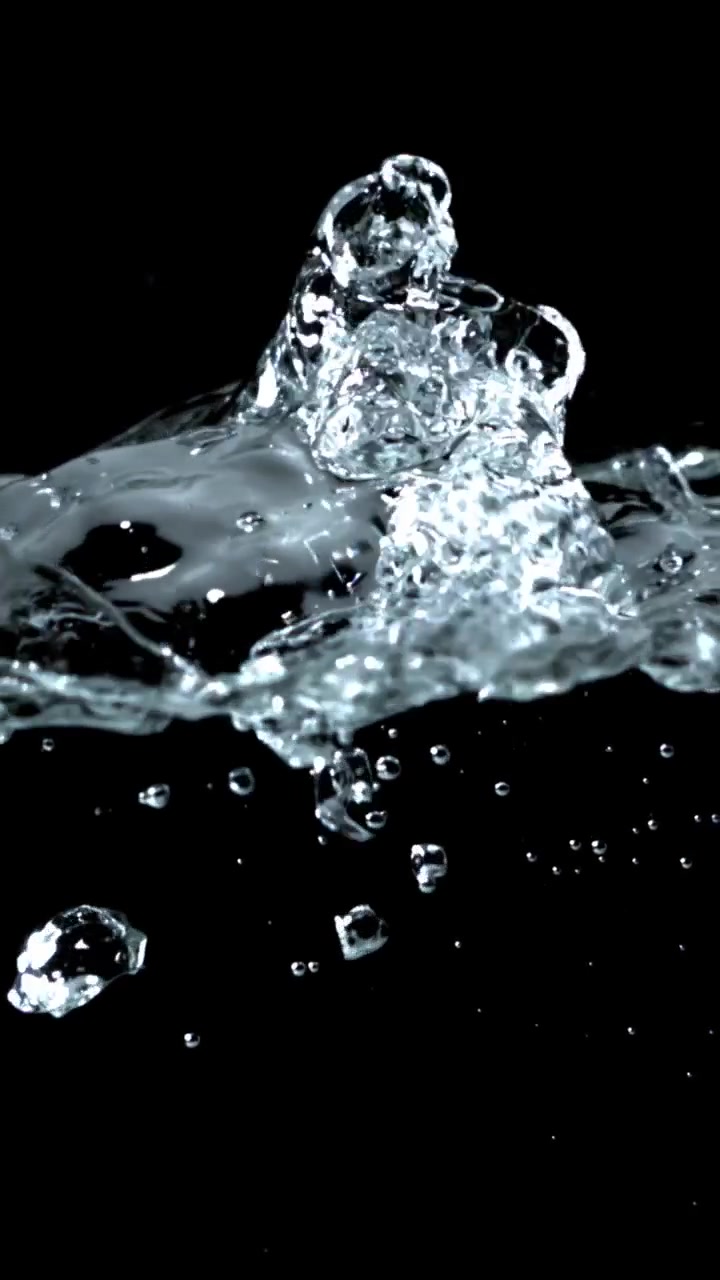 Slow Motion Bubbles Rising and Splashing in Clear Water