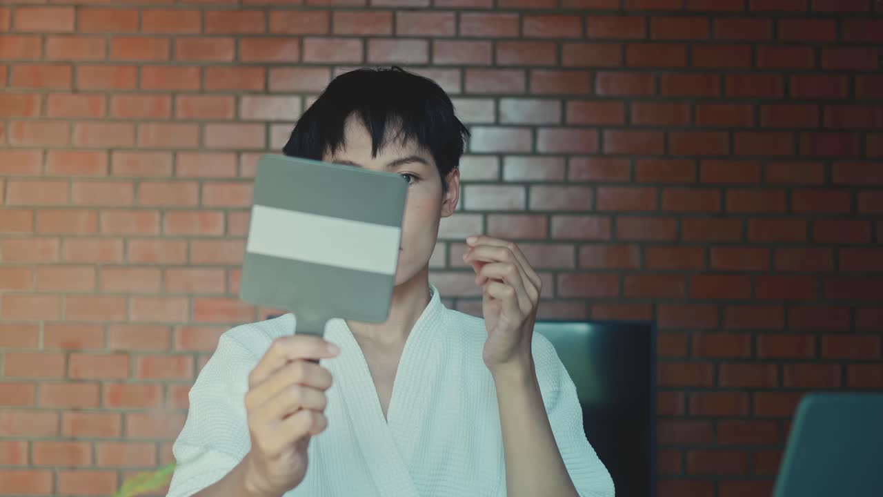 Person in a bathrobe, getting ready