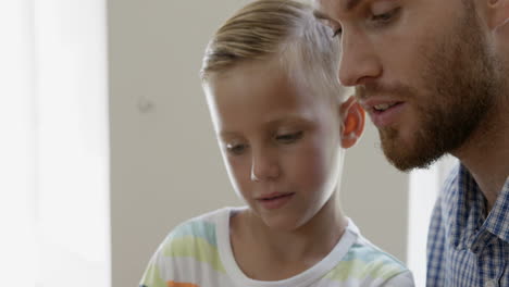 close up view of father and son talking