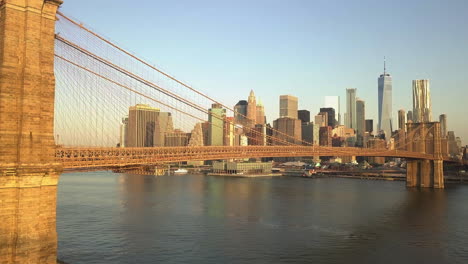 AERIAL:-View-of-Brooklyn-Bridge-in-Beautiful-Golden-Orange-Sunset-Light-in-New-York-City