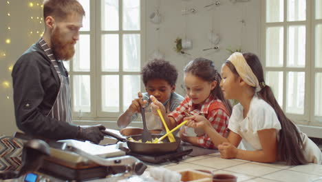 little kids cooking with chef on culinary lesson