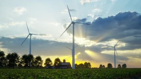 wind turbines standing in sunset. farm with wind turbines. generating clean renewable energy. bright orange sunset. alternative energy