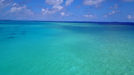 turquoise waters of the caribbean sea, drone footage wide angle vertical movement