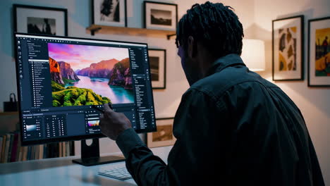 person editing a photo on a computer.