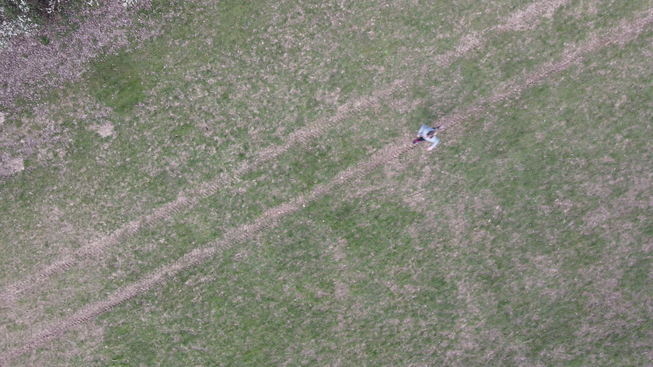 Female Model Training Run In Park. Outdoor Cardio Health And Fitness Training. Fitness Drone Shot In Woods.