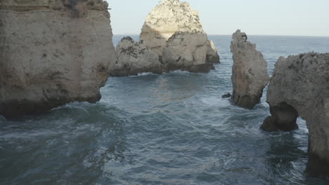 close up of waves hitting a cliff