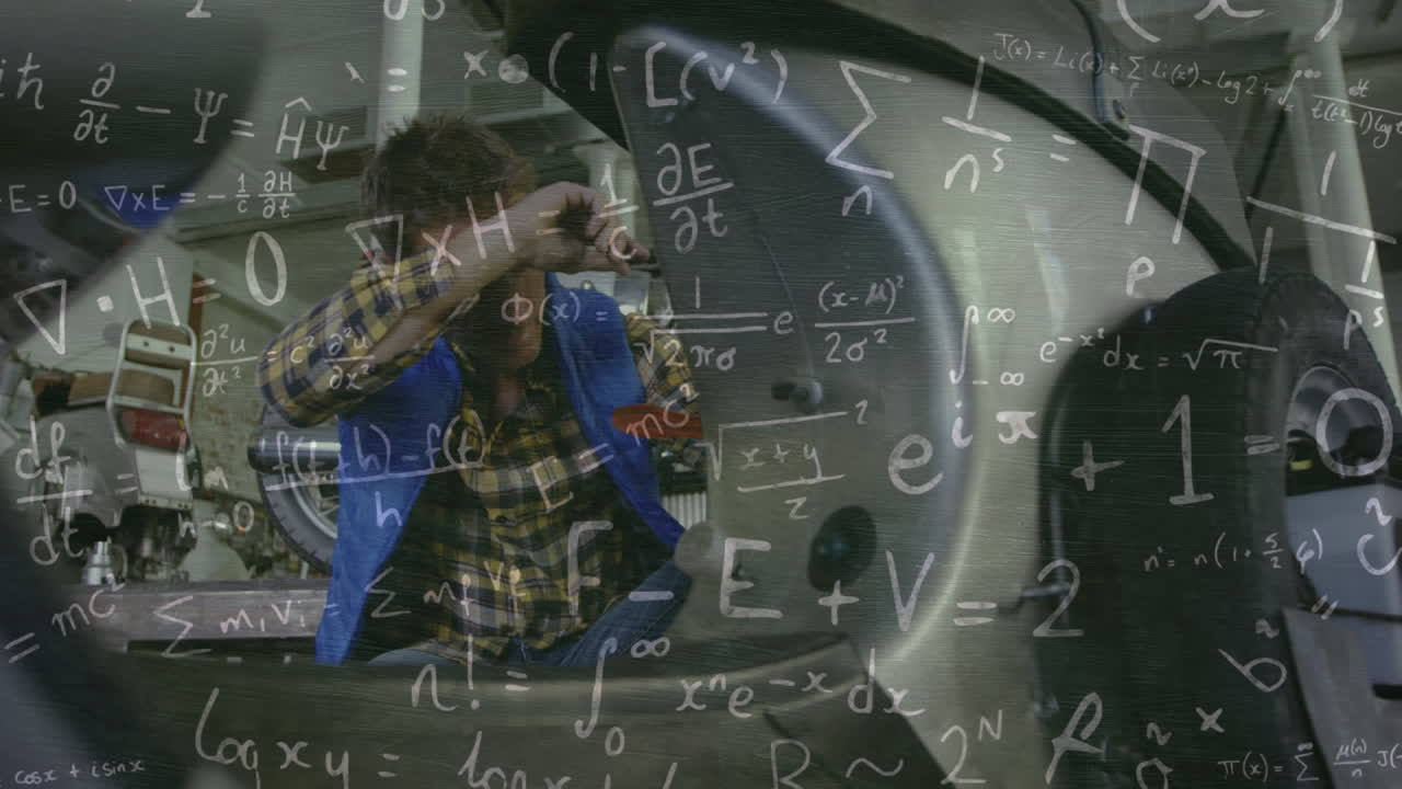 워크에서 백인 남성 기계학자에 대한 수학적 방정식의 애니메이션