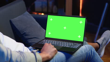 confident young freelancer using isolated copy space in the living room