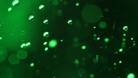 abstract science or art background with green bubbles rising