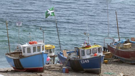 fishing boats sitting on dry harbour