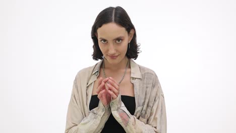 portrait of a young woman posing with clasped hands
