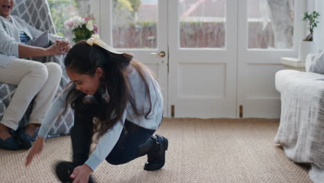 happy girl dancing for grandmother funny child showing breakdance moves to granny at home 4k