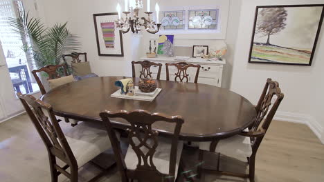 wooden dining room table in a modern white home