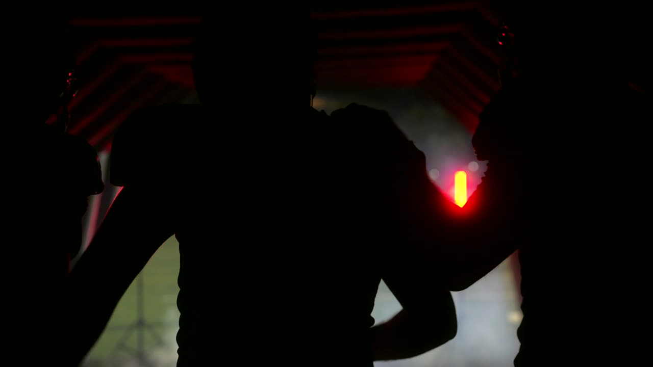 Football players emerging from a tunnel