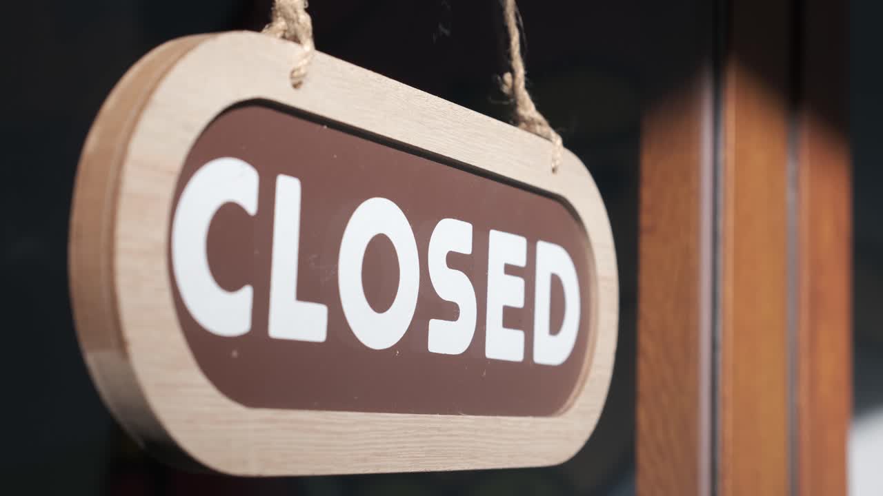 Small business opening up. Turning the sign from close to open. 4k 60fps