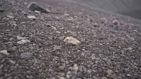 Stones-rolling-down-slope-in-mountains