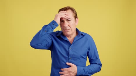 man experiencing headache, stomach ache, and forgetfulness
