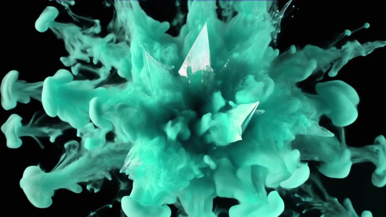 Turquoise Ink Spreading in Water Against Black Background