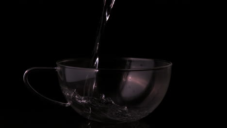 water pouring into clear cup