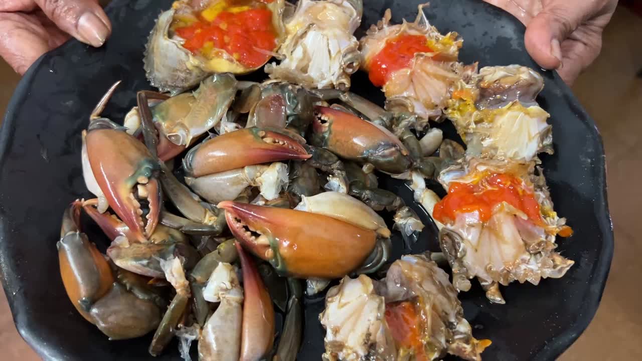 Raw red crabs preparing for cooking after removing the shell in India