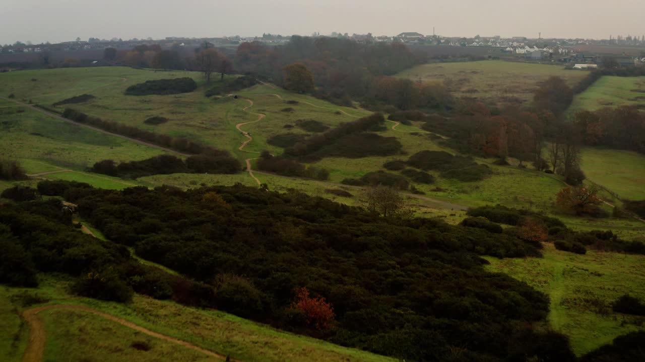 Aerial View of Rolling Hills and Winding Paths