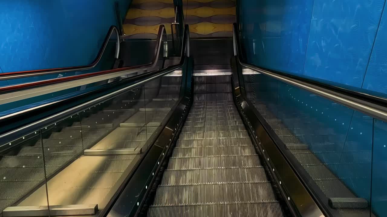 Experience a smooth escalator journey with vibrant blue walls and sleek handrails in a contemporary transit setting.