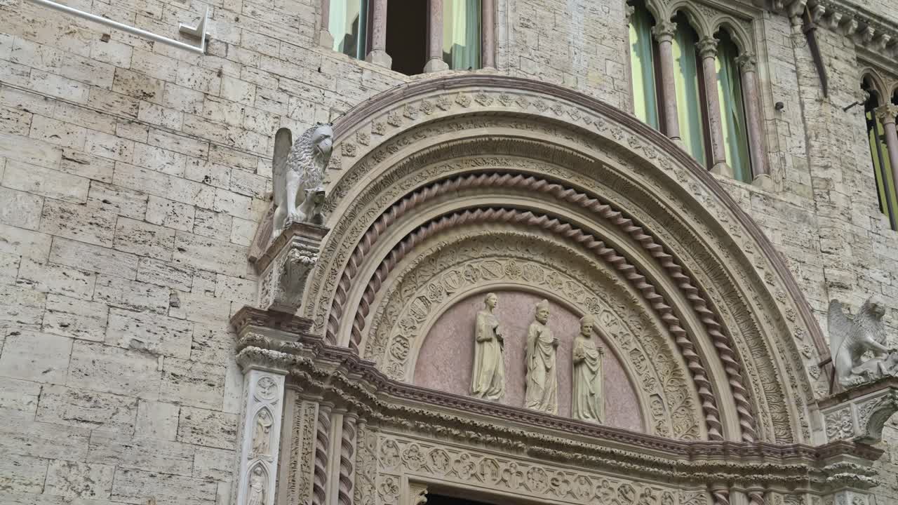 Detail above a door on the exterior fa&ccedil;ade of the historic Umbria National Gallery in Perugia, Province of Perugia, Italy