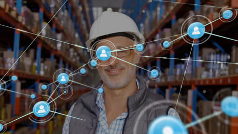 Animation-of-network-of-connections-over-caucasian-man-working-in-warehouse